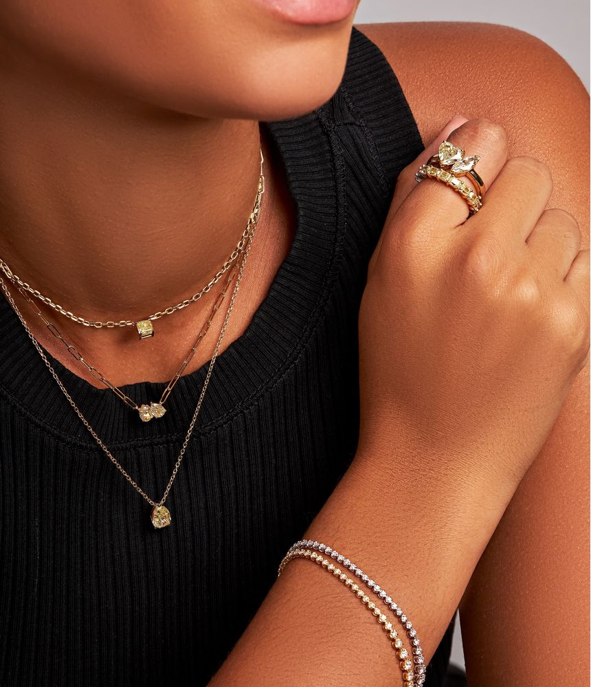 anel-alianca-inteira-de-ouro-amarelo-e-branco-com-diamantes-baguete